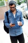 Modern Young Man With Mobile Phone In The Street Stock Photo