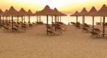 Tropical Beach Huts At Sunrise Stock Photo