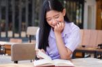 Asia Thai High School Student Uniform Beautiful Girl Read A Book Stock Photo