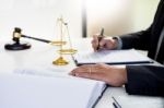 Lawyer Judge Reading Writes The Document In Court At His Desk Stock Photo