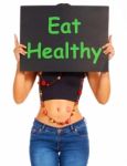 Girl Showing Eat Healthy Sign Stock Photo