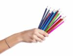 Colored Pencils In A Female Hand On A White Background  Stock Photo