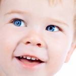 Toddler Blond And Blue Eyes Boy Child With Various Facial Expres Stock Photo