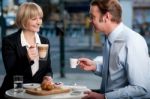 Corporate People Toasting Coffee At Cafe Stock Photo