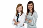 Beautiful Mom And Daughter Posing With Confidence Stock Photo