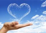 Hand Holding Heart Shaped Cloud Stock Photo