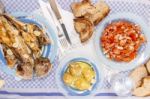 Grilled European Seabass With Potato And Tomato Salad Stock Photo