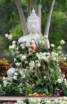 Buddhism Worship With Offering Flowers And Garland To Buddha Statue On Magha Puja, Asalha Puja And Visakha Puja Day In Thailand Stock Photo