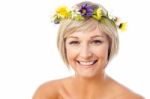 Beautiful Woman In Wreath Of Flowers Stock Photo