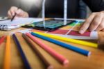 Men Working As Fashion Designer Choosing On Colour Chart For Clo Stock Photo