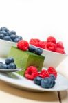 Green Tea Matcha Mousse Cake With Berries Stock Photo