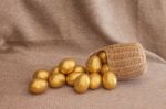 Heap Of Golden Easter Egg In Wicker Basket Stock Photo