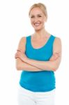 Woman Standing With Arms Crossed Stock Photo