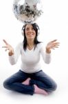 Front View Of Smiling Female Playing With Disco Mirror Ball Stock Photo