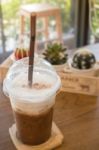 Iced Coffee On Wooden Table Stock Photo