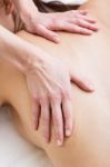 Woman Enjoying Shoulder Massage At Beauty Spa Stock Photo