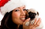 Woman With Christmas Hat And Pug Stock Photo