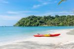 Kayaks On The Tropical Beach With Beautiful Sky Stock Photo