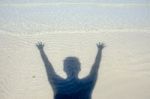 Shadow Man On Beach Stock Photo