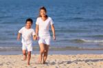 Asian Family On Beach Stock Photo