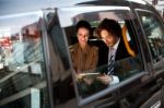 Business People In Taxi Cab Stock Photo