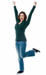 Delighted Young Woman Dancing With Joy Stock Photo