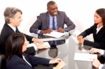 Multi Ethnic Team During Meeting Stock Photo