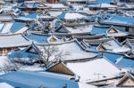 Roof Of Jeonju Traditional Korean Village Covered With Snow, Jeonju Hanok Village In Winter, South Korea Stock Photo