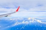 Sky And Clouds. View From The Window Of An Airplane Flying In Th Stock Photo