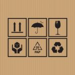 Packaging Symbols Set On Cardboard Background Stock Photo