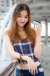 Portrait Of Thai Chinese Adult Beautiful Girl Denim Blue Bag Credit Card Stock Photo