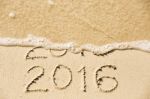 2015 2016 Inscription Written In The Wet Yellow Beach Sand Being Stock Photo