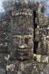 Ancient Stone Faces Of King Jayavarman Vii At The Bayon Temple, Stock Photo