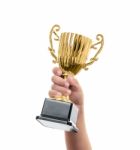 Kid Holding The Golden Trophy Stock Photo