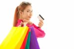 Woman Holding Credit Card And Shopping Bags Stock Photo