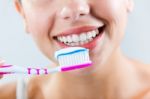 Beautiful Young Woman Picking His Teeth Stock Photo