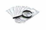 Search Money With Magnifying Glass On White Background Stock Photo