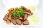 Thai Cuisine, Red Pork And Crispy Pork Over Rice Stock Photo