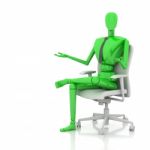 Businessman Doll Sitting On Chair Stock Photo