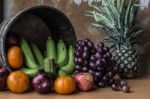 Fresh Fruits On A Wooden Board Stock Photo