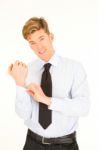 Businessman unbuttoning Shirt Stock Photo