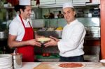 Male Chefs In Kitchen At Work Stock Photo