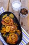 Delicious Baked Chicken Thighs With Lemon Slices, Onion And Zucchini Stock Photo