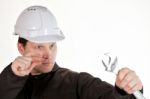 Handyman Wearing Uniform And Hardhat Stock Photo