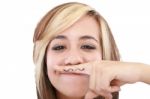 Attractive Girl With Moustache, Using Her Finger Stock Photo