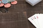 Cards And Poker Chips On Wooden Background Stock Photo