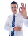 Businessman Showing Ok Gesture Stock Photo