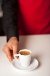 Hands Of Waiter Serving A Cup Of Cappucino Stock Photo