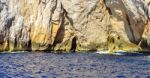 Clear Blue Water Sea With Rocky Coastline Stock Photo