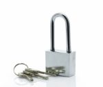 Padlock With Three Keys On White Background Stock Photo